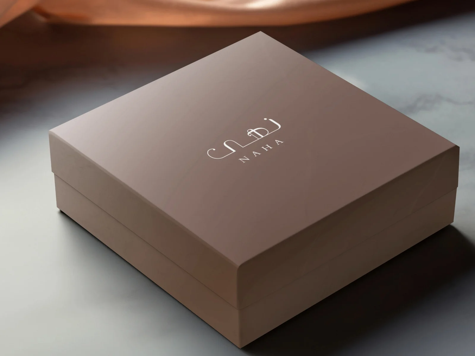 Naha gift box in cocoa brown with the bilingual wordmark